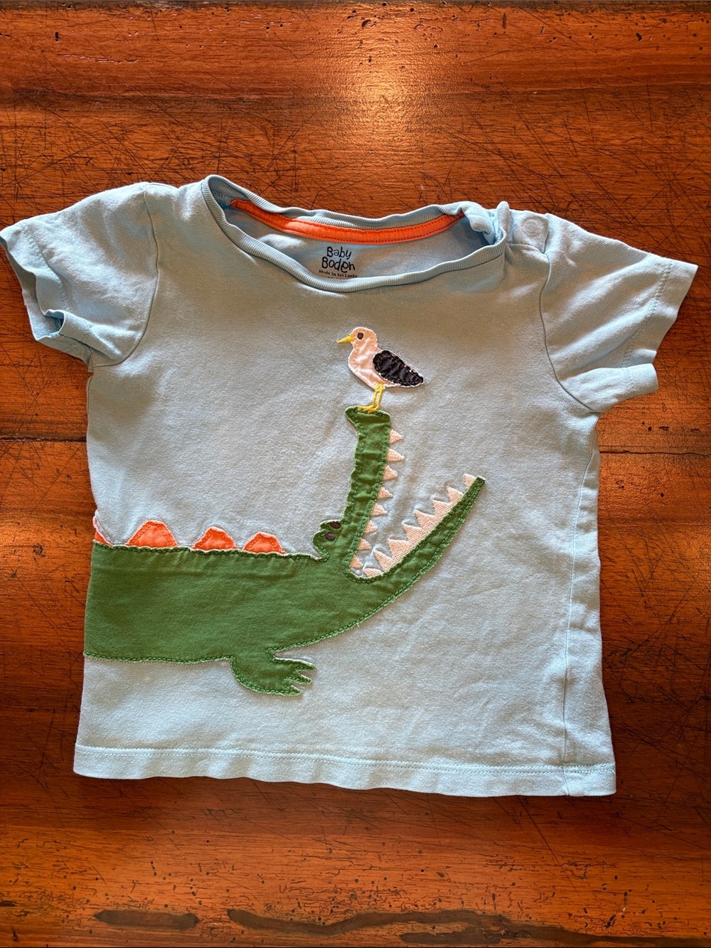 Baby Boden | Light Blue Tee with Green Crocodile and Orange Spikes | 18-24 month